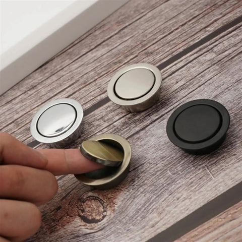 Person using hidden door handle set recessed metal pulls for cabinets and drawers, invisible round wardrobe shoe pulls in assorted colors