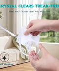 GlintFy lens wipes for eyeglasses, 400-count, pre-moistened; close-up of hand cleaning glasses