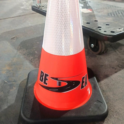 Six Pack 28 Inch Traffic Safety Cones Orange Heavy Duty Construction Cone Set for Roadway Parking and Public Place Traffic Control Pro Grade Weather Resistant PVC on a concrete surface