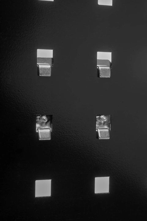 Close-up of Two Blue Pegboards For Heavy Duty Tool Organization And Shop Ready Workshop Storage Measuring 18 By 36 By Nine Sixteenth Inch 18 Gauge Steel Square Hole Panels For Power Tools Hand Tools Maintenance Gear And Oversized Equipment, showing square holes.