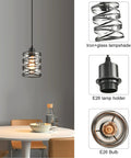 Two Pack Black Spiral Cage Pendant Lights With Clear Glass Shade And Frosted Inner Glass, close-up of one light over table