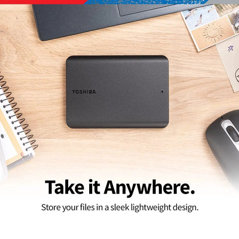 2TB Portable External Hard Drive USB 3 0 Plug and Play with Matte Black Finish on desk with laptop and stationery