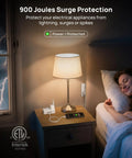 Compact 360 Rotating Flat Plug Power Strip With 5 Foot Cord, Four Widely Spaced Outlets, Heavy Duty Surge Guard, Wall Mountable Slim Body That Crushes Wire Clutter, Perfect For Tight Squeezes And Dorm Digs, Matte White on bedside table with lamp.