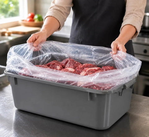 Person holding 12 Pack Meat Lug Liners Disposable LDPE Bags For 4.6 To 7 Gallon Totes And 50 Pound Boxes with meat inside