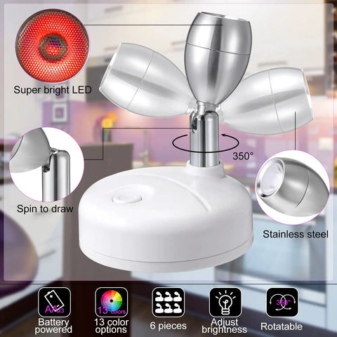 12 Pack Battery Operated LED Spotlight Set With 13 Color Modes Dimmable Indoor Uplights For Art Pictures Paintings And Closet Displays Dope Accent Lighting That Installs In Minutes Requires 3 AA Batteries Not Included, featuring rotatable stainless steel spotlights and adjustable brightness controls.
