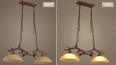 Rustic Retro Two Light Chandelier With Hand Dyed Resin Antlers On Frosted Glass Bowl, on and off view for kitchen dining lighting.