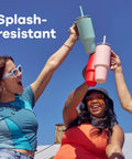 On The Fly 40 Oz Stainless Steel Travel Tumbler With Comfort Grip Handle And Leak Proof Straw Lid held by friends outdoors.