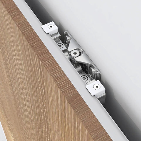 Close-up of Slick Concealed Barn Door Hardware Kit with Soft Close Mechanism for Hidden Ghost Sliding Door System on aluminum track.