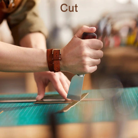 Person using skiving knife from Six Piece Leather Edge Tool Kit With Four Graded Edge Bevelers 0.8mm 1.0mm 1.2mm 1.5mm One Skiving Knife And A Burnisher For Finishing Belts Wallets Bags And Shoes The All In One DIY Leather Craft Set For Smooth Edges And Pro Results on a cutting mat