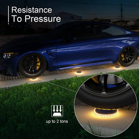Car driving over Solar Deck Lights Outdoor Waterproof LED 4 Pack Warm White Dock Lights With Big Solar Panel Solar Powered Lights