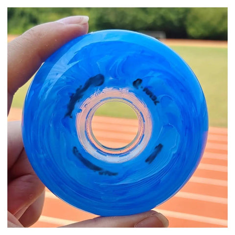 Blue inline skate wheel held outdoors, illustrating design of Pink Inline Skate Wheels Replacement Set 72Mm 76Mm 80Mm 83A Hardness