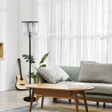 Crystal Floor Lamp With Foot Pedal Dope Modern Standing Light For Living Room Bedroom And Office Black Tall Pole Indoor 3 Light Fixture Elegant Contemporary Decor And Warm Ambience next to a sofa in a bright living room.