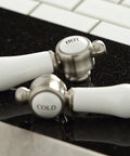 Replacement handles for Bel Air Basin Tap Faucet With Lever Handle Brushed Nickel Finish, displayed on countertop