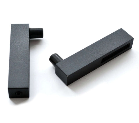 Close-up of two black iron track connectors from Ornate Cut Roller Black Iron Sliding Barn Hardware Kit For Single Door Hardware Only, Door Not Included 5 Foot Track With Wall Mount Supports Up To 270 Lbs Fits Doors Up To 30 Inches Wide And 1 3 8 To 1 3 4 Inches Rollers Stoppers Track Connectors.