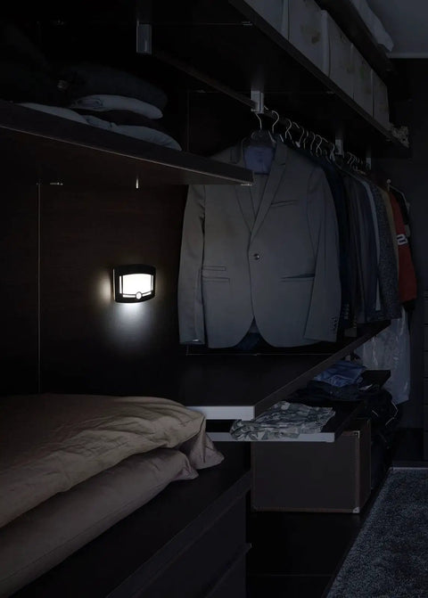 Motion Sensor Wireless Lights Two Pack Hands Free Wave Activated Touchless Dimming Wall Lights illuminating a walk-in closet