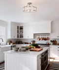 Three Light Brushed Nickel Semi Flush Ceiling Light With Fabric Shade And Glass Diffuser in a modern white kitchen