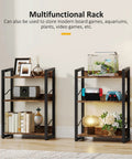 Three Tier Narrow Bookshelf With Edge Protection And Side Cross Tube Design For Picture Frames Statues Easy Peasy Setup, showing storage with decor and plants.