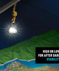 Moonlit Rechargeable Micro Lantern for Camping and Hiking hanging in tent with glowing light, showcasing carabiner clip and swivel feature