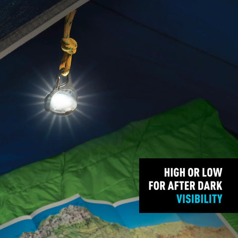 Moonlit Rechargeable Micro Lantern for Camping and Hiking hanging in tent with glowing light, showcasing carabiner clip and swivel feature