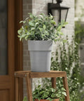 Stealth Mini Flower Pot Safe With Realistic Plant Deco And Key Lock Secret Stash Box for Cash Keys on wooden stand outdoors.