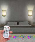 Set Of Two Cordless Wireless Wall Light With Remote Battery Operated Sconce RGB Vibe Lamps in bedroom setting with remote control.