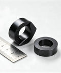 20 Pack 3/8 Inch Black Cable Railing Angle Washers T316 Marine Grade Stainless Steel Rock Solid 30 Degree Beveled Brackets Pro Team Gear For Sloped Stairs And Rugged Deck Installations Top Shelf Alignment Slick Finish in black with ruler for size comparison.