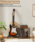 Vintage Brown Guitar Amp Stand With Double Rack For Acoustic Electric Bass And Ukulele Storage Holder Heavy Duty Floor Stand Sturdy And Wide Base securely holds two guitars and an amp with a stylish design.