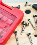 Pro Level 14 Piece Forstner Drill Bit Set Featuring Hella Sharp Carbide Tips And Rock Solid Alloy Steel Build on a wooden surface.