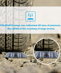 12 Pack Solar Deck Lights under truck tire showing durability and pressure resistance