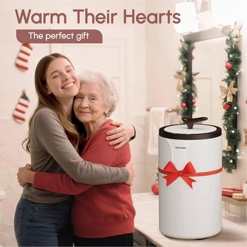 Heavy Duty Iron Adjustable Towel Warmer Stand in holiday setting with two women hugging, showing gift potential for bath or spa.