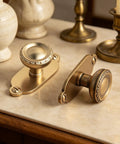 Top Notch Heavy Duty Solid Zinc Cabinet Knobs With Vintage Oval Beaded Back Plates Antique Brass Finish six pack on countertop.