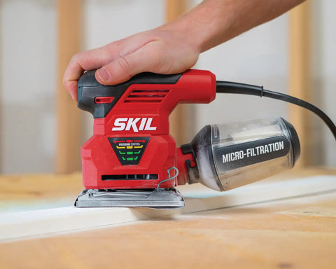 Person using 2.0 Amp 1/4 Sheet Palm Sander With Pressure Control, Clear Dust Canister, Micro Filtration, And Dust Sealed Switch