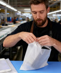Person using 100 Pack Foam Bags 11.8 By 11.8 In White Cushioned Pouches With Protective Film For Moving And Shipping Anti Scratch Shockproof
