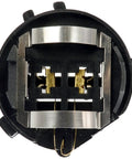 Close-up of a low beam headlight bulb socket for VW models, showing durable replacement connector with corrosion-resistant contacts.