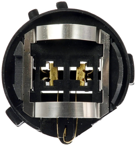 Close-up of a low beam headlight bulb socket for VW models, showing durable replacement connector with corrosion-resistant contacts.