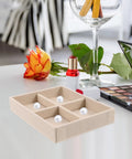 Beige Velvet Jewelry Display Tray With Four Grids And Sturdy Wooden Lid For Ring Bracelet Earring Storage Stackable Vanity Organizer on a table.