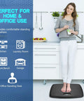Woman standing on Anti Fatigue Standing Mat With Massage Points For Kitchen And Office, Portable Floor Rug, 17 by 22 inches, Black
