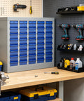 40 Drawer Steel Parts Cabinet With ABS Bin Organizers for garage and workshop on a workbench with tools and drill bits.