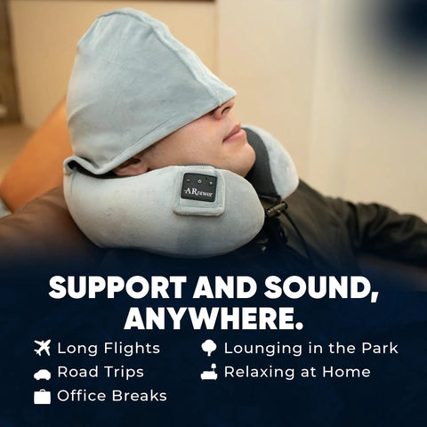 Person wearing Wireless Bluetooth Music Neck Pillow With Hood For Travel Sleep Semicircular Design With Built In Speaker in lounge