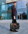 Man holding Waterproof Weekender Carry On Duffel For Women Durable Gym Bag And Overnight Travel Tote with Black Rooster Design