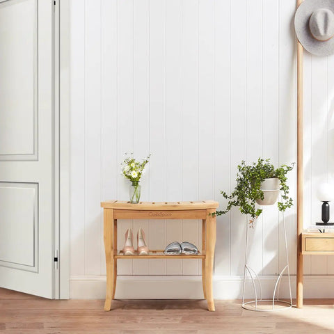 Bamboo Shower Bench 19 Inch Waterproof Shower Chair With Storage Shelf in a bathroom setting, displaying shoes and potted plants.