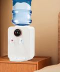 Countertop Water Dispenser With Hot Cold And Room Temperature Settings Desktop Water Cooler For 1 To 5 Gallon Jugs Ideal For Home Office Dorm Your Go To Hydration Station With Easy Pour And Durable White Finish on a wooden surface