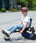 Child using Hoverboard Go Kart Attachment With Dual Shock Absorbers And 6 Inch Off Road Wheel on pavement