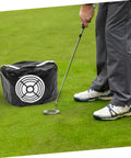 Golfer using Compact Golf Swing Trainer Impact Hitting Bag for outdoor practice, demonstrating swing accuracy, tempo, and technique.