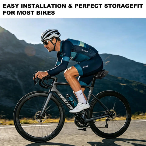 Cyclist on road bike with waterproof bicycle seat bag with built in pump and 15 in 1 tool kit against mountain backdrop