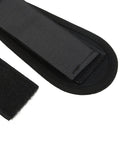 Close-up of black adjustable skateboard foot strap with secure hook and loop closure, fits 18 to 24 cm, for longboards and scooters