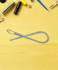 Foldable Drawstring Threaders Kit With Latch Hook 20 Pieces DIY Rope Threader Set for Hoodies and Pants on yellow surface