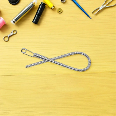 Foldable Drawstring Threaders Kit With Latch Hook 20 Pieces DIY Rope Threader Set for Hoodies and Pants on yellow surface