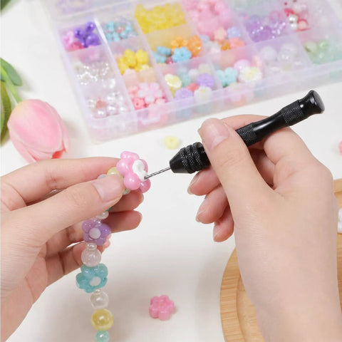Using Badass Mini Micro Drill Bit Set With Tough Pin Vise to add beads in jewelry making, with colorful beads in background.
