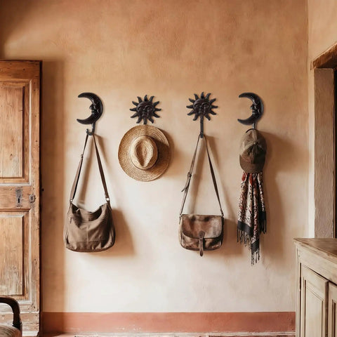 Solid As A Rock Vintage Cast Iron Sun Moon Wall Hooks Heavy Duty decorative hangers hold bags and hats on a wall.